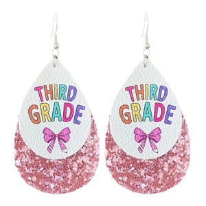 Detailed view of layered leather teardrop earrings with Third Grade pencil and bow design