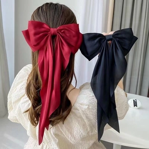 Elegant large red and black satin bow hair clips with long streamers for women