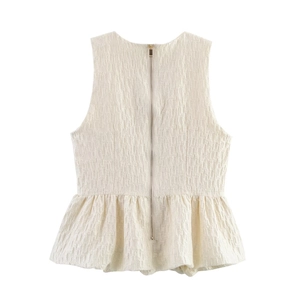 Ensemble haut péplum sans manches et jupe blanche en tissu texturé avec zip au dos