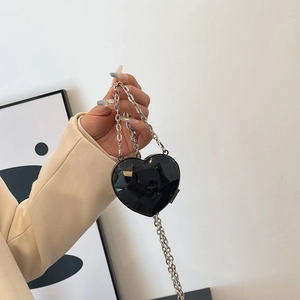 Mini heart-shaped black evening bag with geometric gemstone cut and silver chain strap