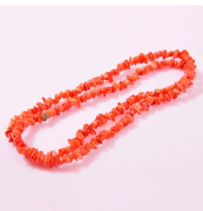 Macro detail of natural irregular red coral beads for DIY jewelry making