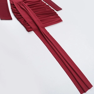 Close-up of wine red ruched bodycon dress detailing fine texture and long decorative waist tie