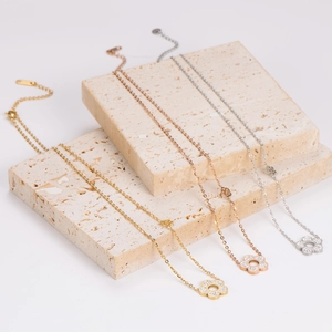 Sparkling crystal flower necklaces in gold, silver, and rose gold stainless steel