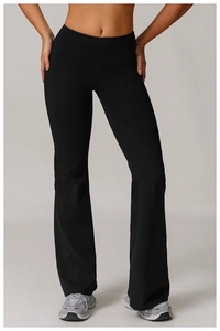 Detail showing high-waisted wide waistband and elastic fabric on black yoga flare pants