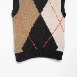 Women's V-neck argyle knitted vest in black and camel color block diamond pattern