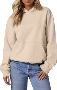 Close-up of oversized cream hoodie with drop shoulder design and textured fabric detail