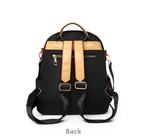 Back view of black and khaki backpack featuring hidden zipper pocket and gold hardware