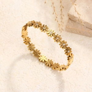 Bracelet marguerite doré en acier titane avec des cristaux de zircon blanc étincelants