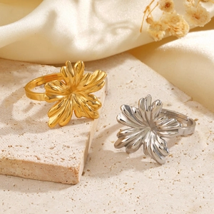 Minimalist 18K gold and silver floral rings with adjustable bands on stone decor