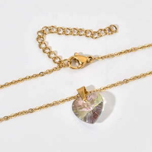 Detail of adjustable gold-plated chain with colorful crystal heart pendant and lobster clasp