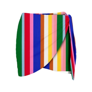 Detailed view of a multi-colored vertical striped wrap skirt with asymmetric hem for beach
