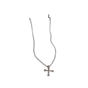 Minimalist silver cross necklace with bone texture design on a clean white background