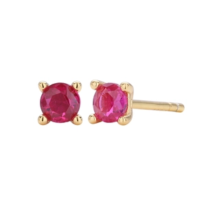 Detailed close-up of 925 silver stud earrings with red round cut stones in gold setting