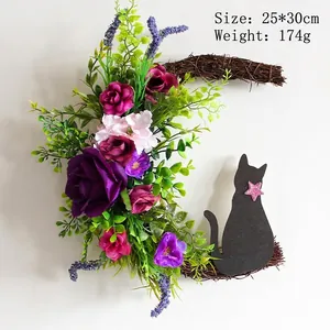 Halloween crescent moon cat wreath with purple roses and vine twigs on white wall