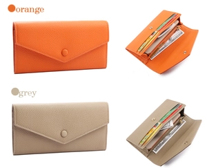 Detailansicht großer Lederbrieftaschen in Orange und Grau mit vielen Kartenfächern