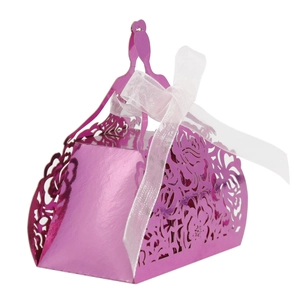 Macro shot of mirror-finish rose laser cut flower gift box with elegant white ribbon