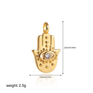 Detailed view of gold Hamsa hand pendant with blue evil eye zircon and size dimensions