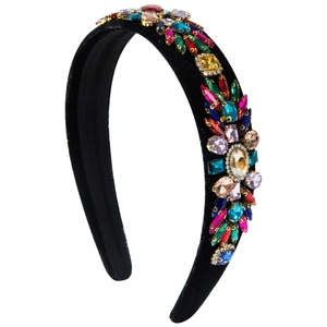 Vintage velvet padded headband featuring colorful crystal gemstones on a white background