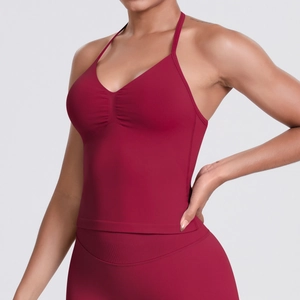 Detail of burgundy seamless sports tank top with thin straps and V-shaped pleated chest