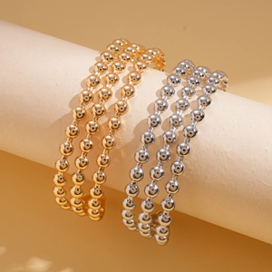Bracciali rigidi geometrici a tre strati con finiture lucide in oro e argento