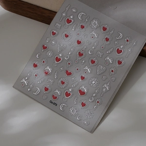 Detail of CO-373 nail art stickers with red hearts, silver moon, and stars patterns