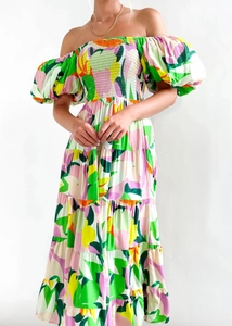 Detail view of the elastic smocked bodice and tiered floral skirt on a summer dress