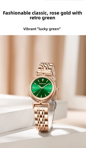 Detail view of a rose gold watch with a green sunray dial on a minimalist white stand