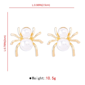 Detail view of vintage spider earrings with measurements and pearl texture on white background