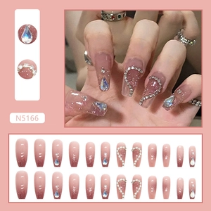 Detail of pink gradient ballet press-on nails with silver glitter and heart rhinestones