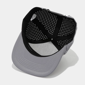 Detail view of the breathable laser-cut inner mesh lining of this flat brim baseball cap