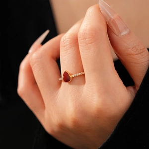 Macro shot of a red gourd ring in 18k gold plating with sparkling cubic zirconia