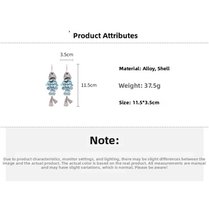 Fish shaped shell tassel earrings detail showing dimensions of 11.5cm by 3.5cm