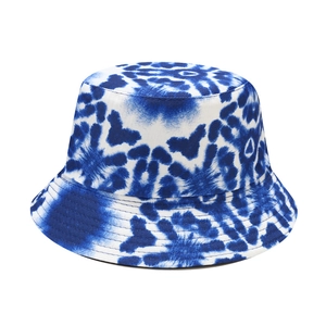 Detail of blue and white tie-dye bucket hat showing stitching and fabric texture