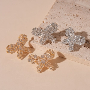 Exquisite gold and silver butterfly stud earrings with sparkling cubic zirconia stones