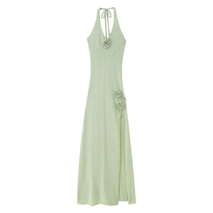 Light green backless halter knit maxi dress with flower detail and side slit
