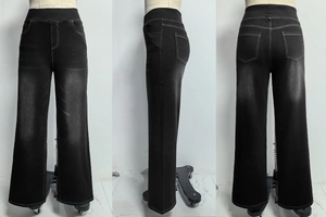 Detail der schwarzen High-Waist-Wide-Leg-Jeans mit Kontrastnähten und Whiskered-Fade