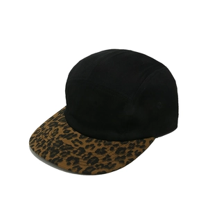 Close-up of a black 5-panel baseball cap with a stylish leopard print flat brim.