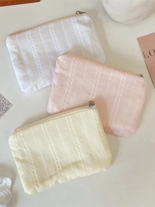 Quilted vertical striped travel cosmetic bag in white pink and yellow knit fabric