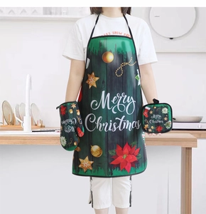 Detailed Christmas kitchen set with green festive apron, oven mitt, and heat-resistant mat