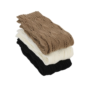 Three pairs of knit leg warmers in brown beige and black with hollow leaf pattern