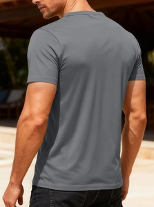 Close-up of gray short-sleeve V-neck t-shirt fabric and athletic fit on male model