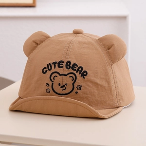 Close-up of cute bear embroidery and 3D ears on a breathable khaki baby sun hat