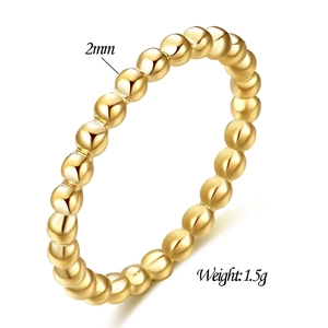 Detail showing 2mm width and 1.5g weight of gold beaded stainless steel ring