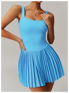 Macro shot of bright blue tennis dress featuring pleated hem and square neckline design