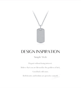 Detail of square silver dog tag pendant necklace with shimmering moissanite pave setting