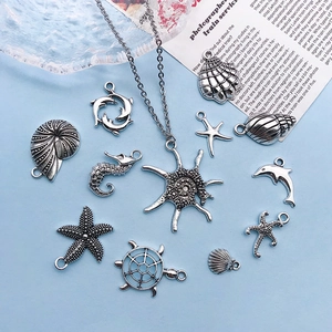 Set of silver ocean pendants with necklace featuring starfish and sea turtle charms