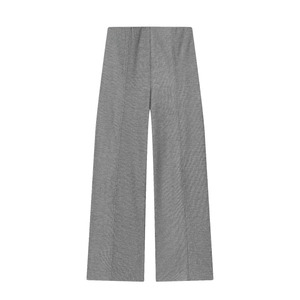 Close-up of grey knitted trousers with vertical ribbed texture and elastic waistband