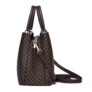 Brown vintage leather tote bag with DH pattern and detachable crossbody strap
