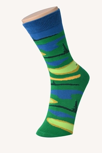 Detailed view of cotton socks featuring a nature landscape pattern with green and blue trees