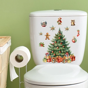 Detail of Christmas tree and gift box wall decals applied on a white surface
